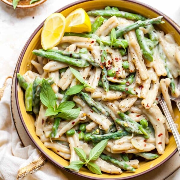 Creamy pasta in a yellow bowl