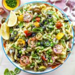 Creamy pasta salad with chives, dill, and tomatoes tossed with lemon dressing