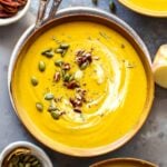 Butternut Squash and Apple Soup topped with pumpkin seeds and pecans