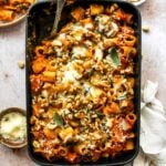 Cheesy pumpkin pasta bake with mushrooms, spinach, creamy pumpkin tomato sauce