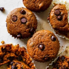 Pumpkin muffins cut into on a white board