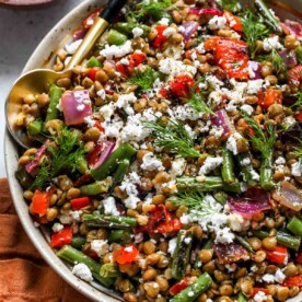 Mediterranean Lentil Salad topped with feta in a serving bowl
