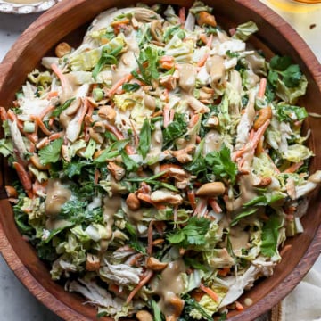 Chicken cashew crunch salad in a large wooden serving bowl.
