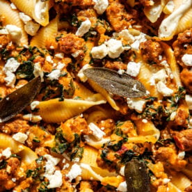 Spicy pumpkin and feta stuffed shells topped with crispy sage leaves and extra feta.