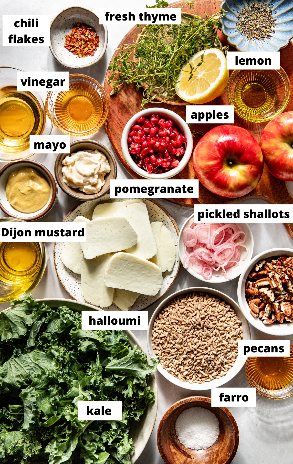 Recipe ingredients in separate bowls arranged on a white surface with labels.