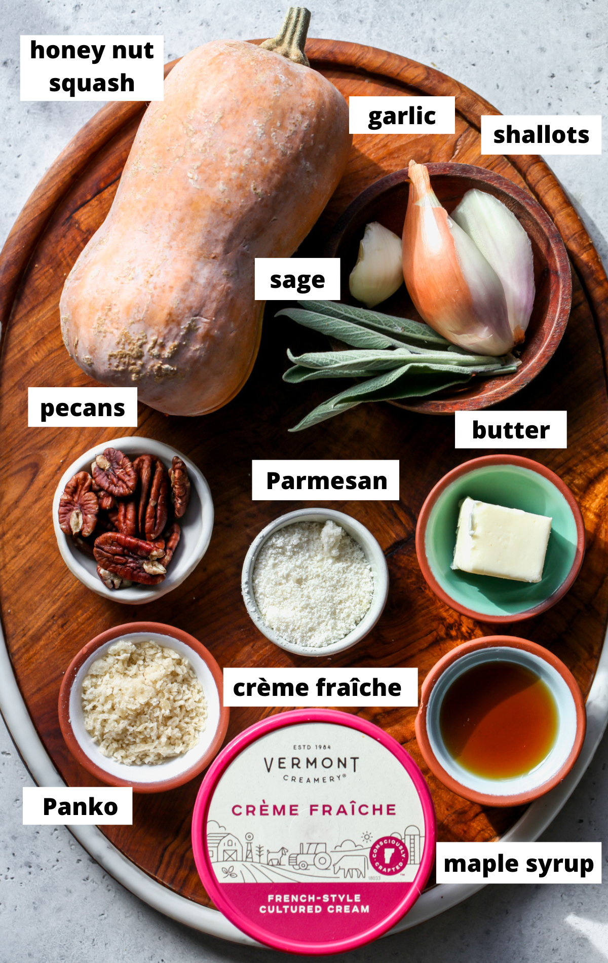 Recipe ingredients arranged on a wooden platter with labels.
