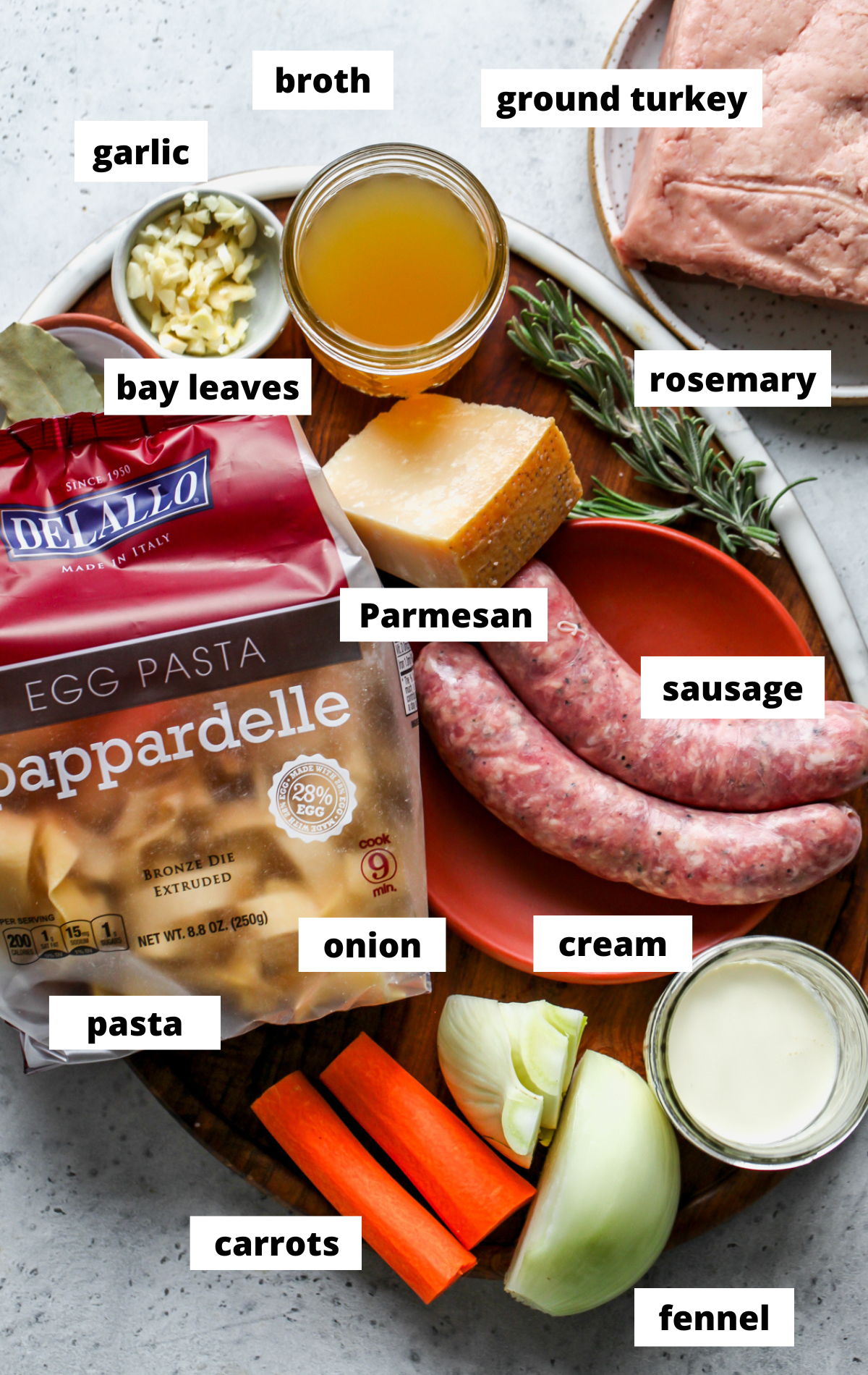 Recipe ingredients arranged on a wooden board with labels.