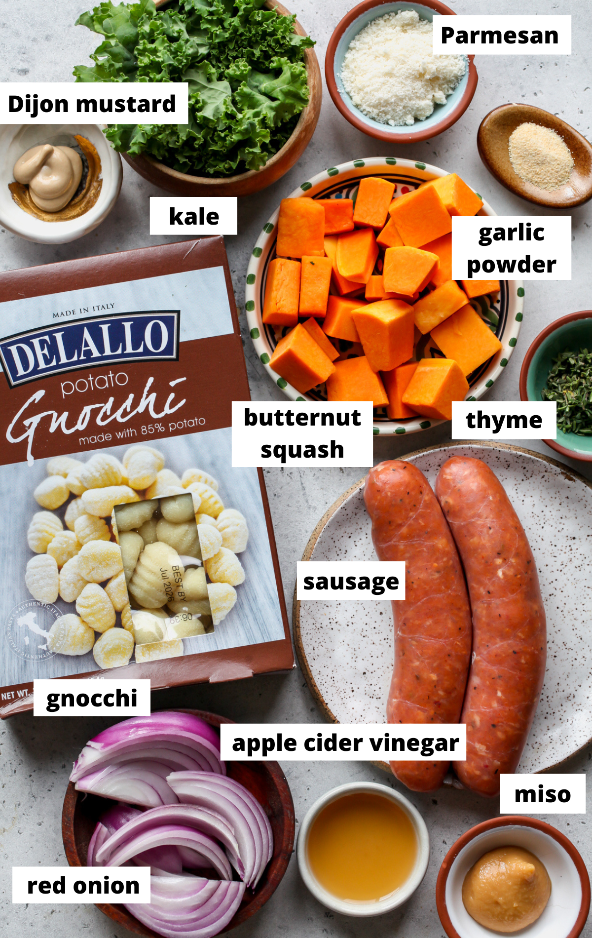 Recipe ingredients arranged on a blue surface with labels.