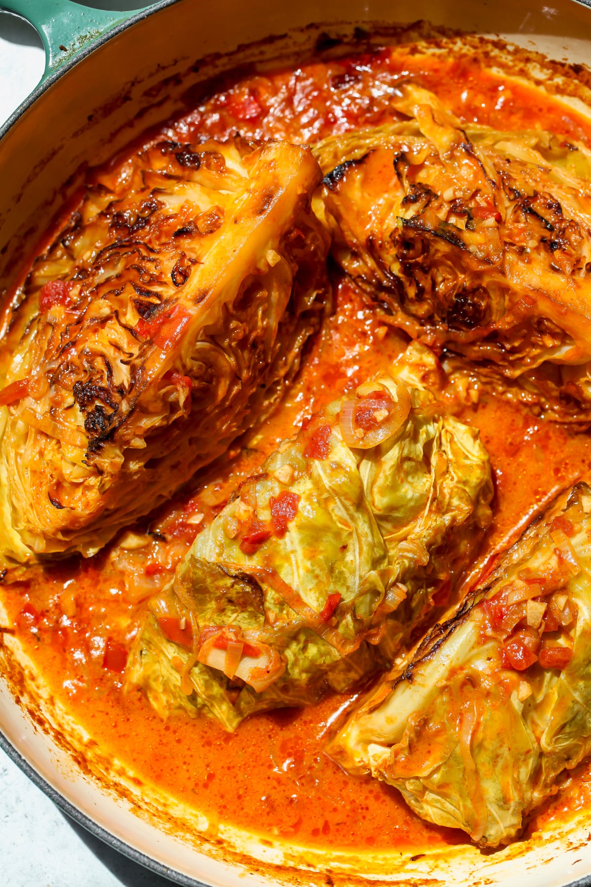 Cabbage wedges in a harissa coconut sauce after braising.