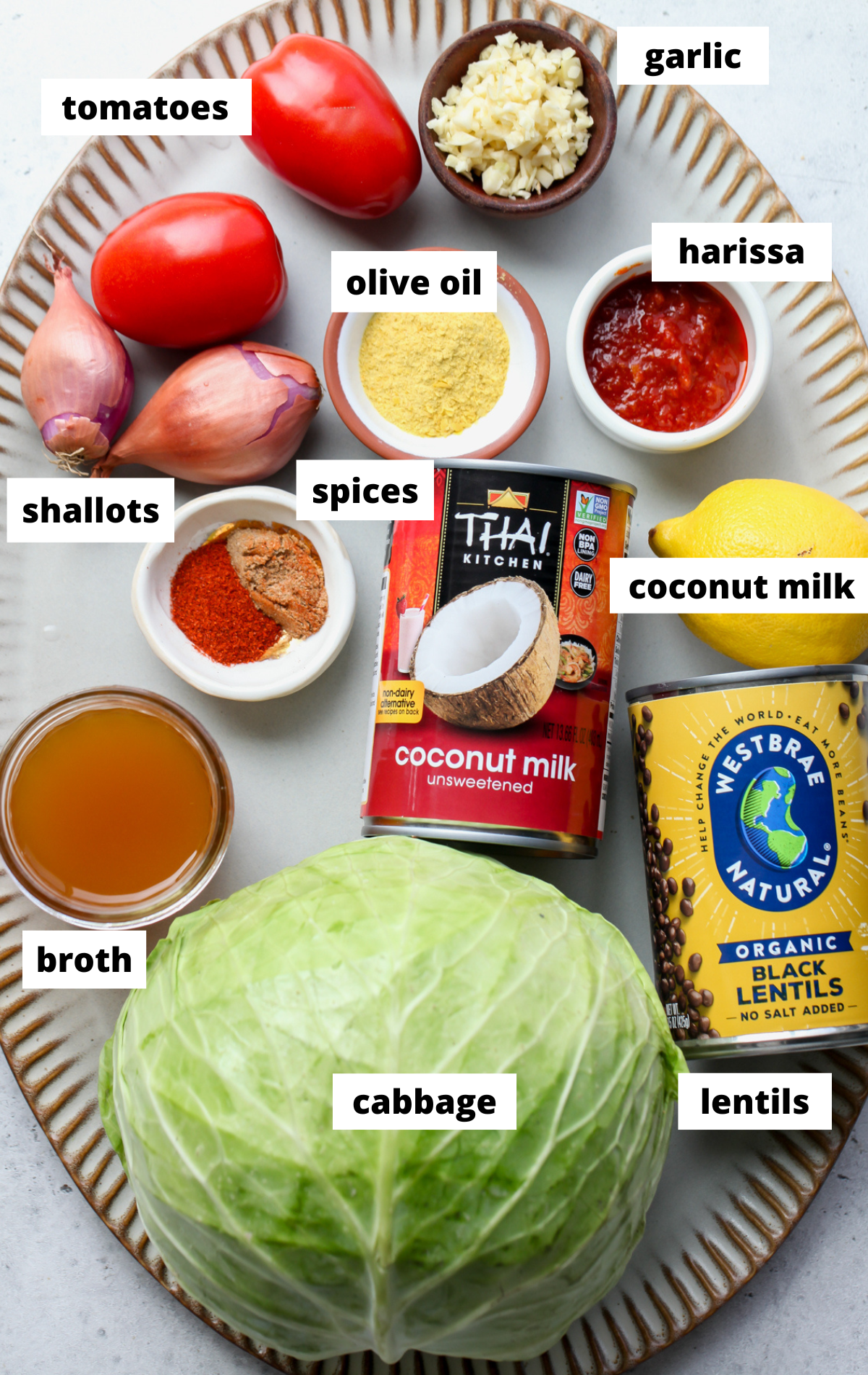 Recipe ingredients arranged on a large scalloped platter with labels.