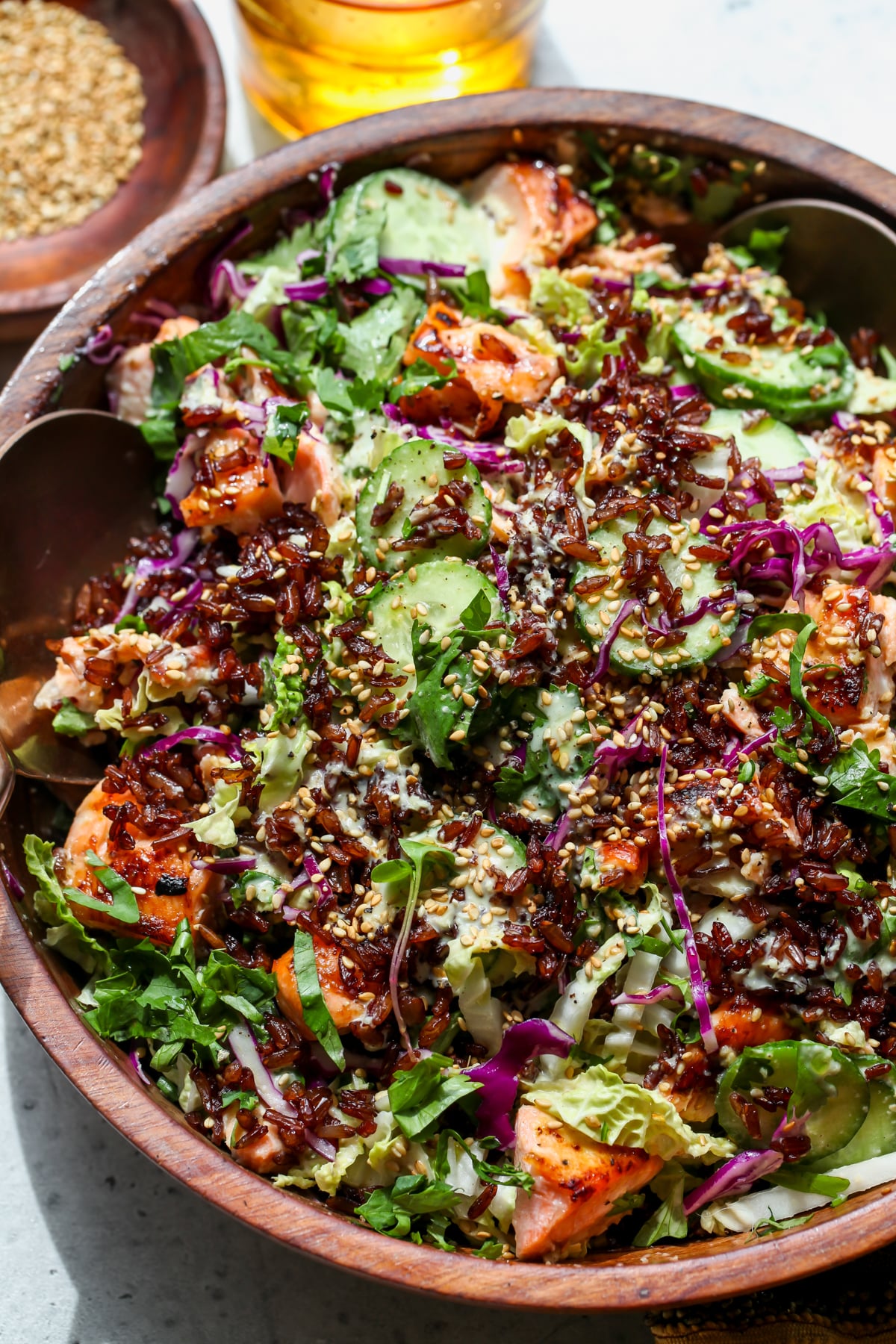 Miso-Ginger Salmon Crispy Rice Salad styled in a large wooden serving bowl.
