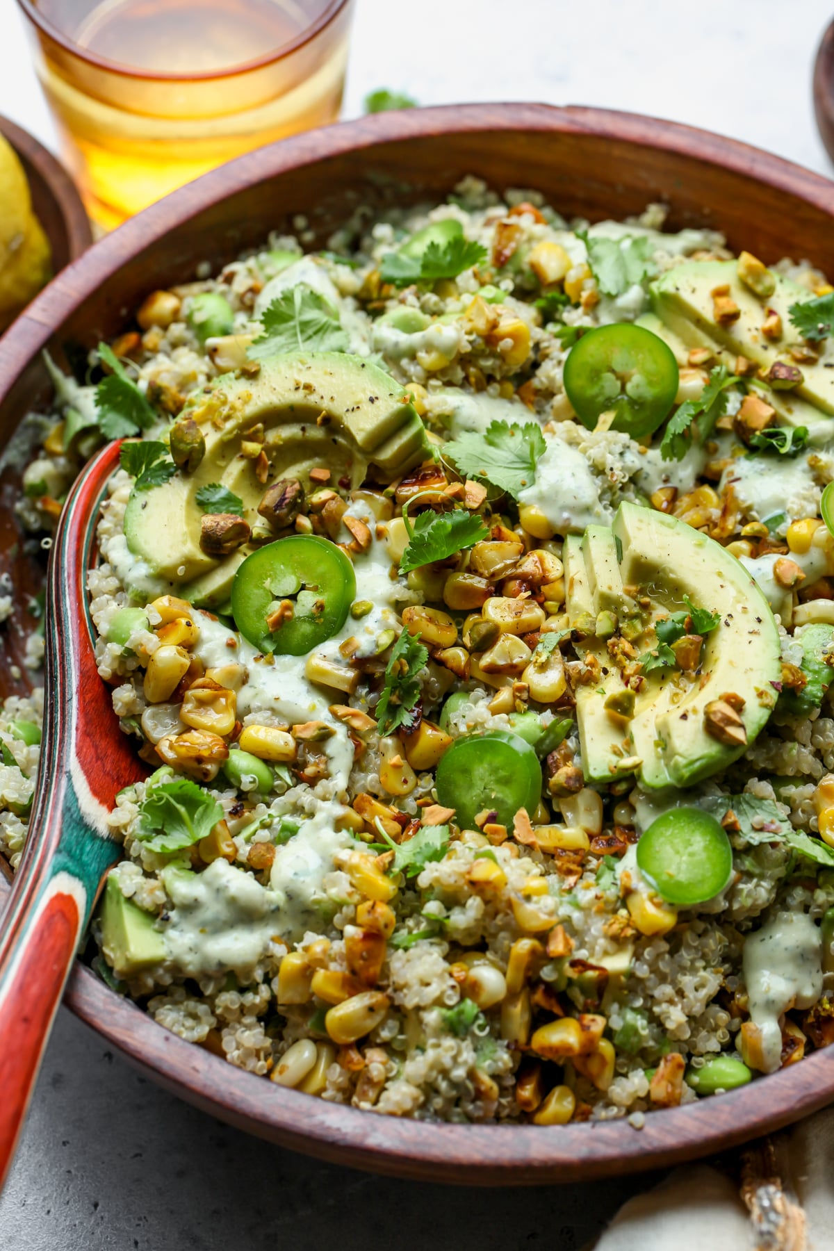 Corn and Edamame Quinoa Salad styled in a large wooden serving bowl.