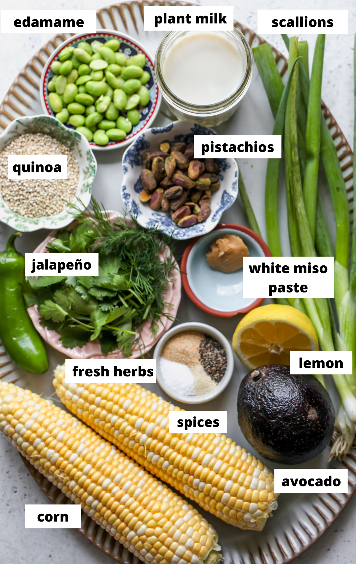 Recipe ingredients arranged on a large scalloped platter with labels.