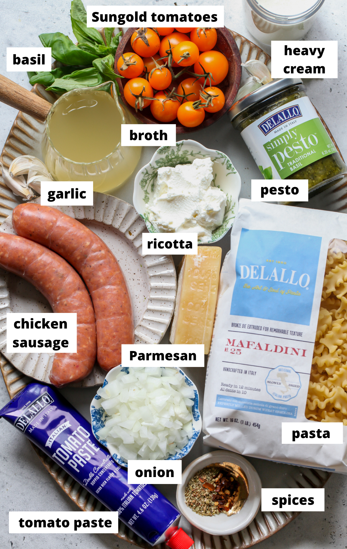 Recipe ingredients arranged on a large scalloped platter with labels.