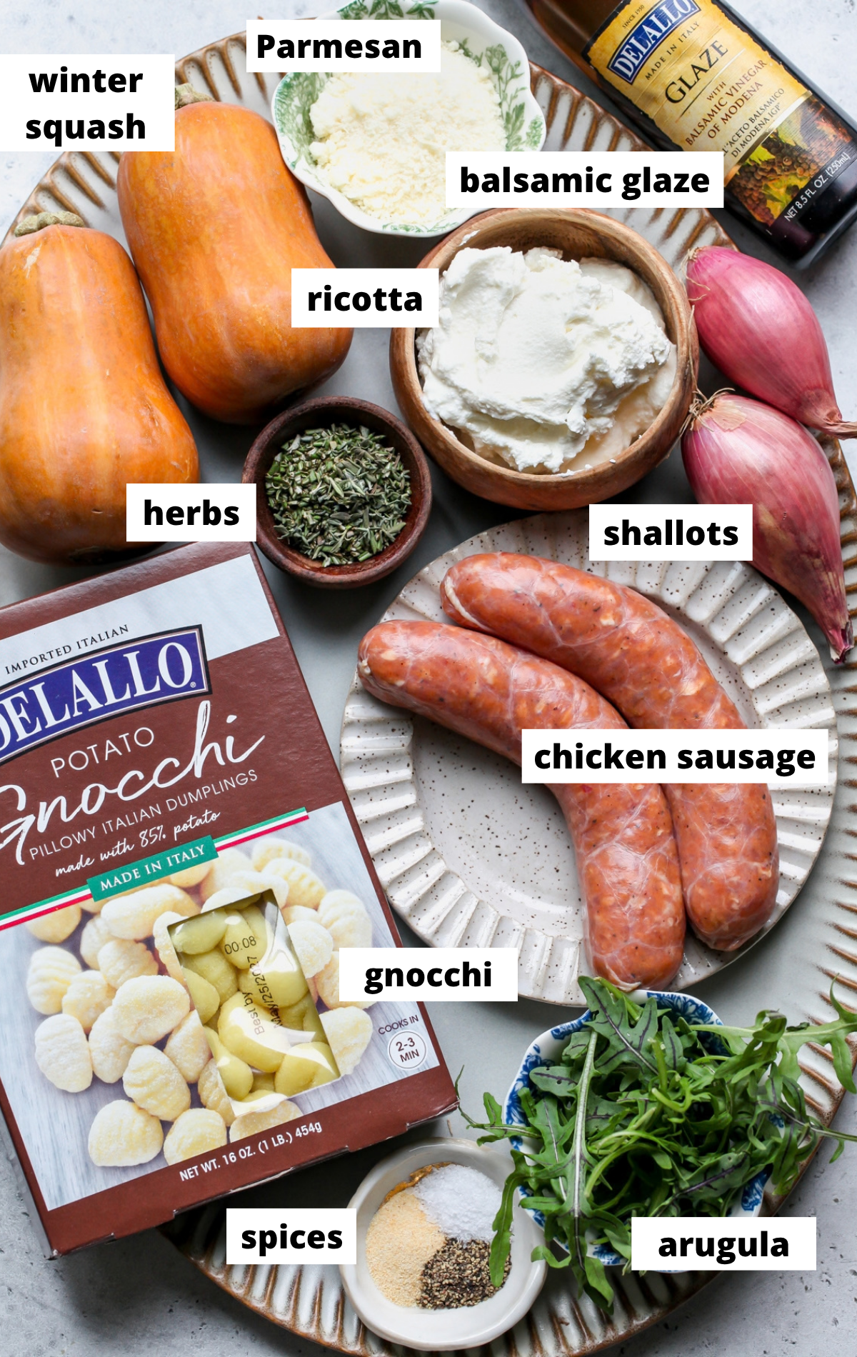 Recipe ingredients arranged on a large scalloped platter with labels.